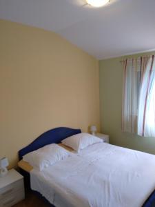 Postel nebo postele na pokoji v ubytování Apartment Ivo