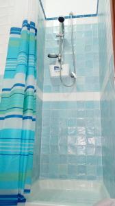 a bathroom with a shower with a shower curtain at Annabella's Country House in SantʼAntonio Abate