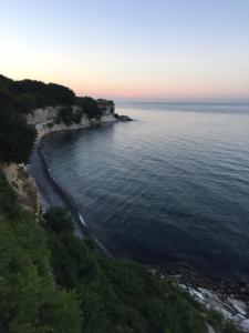 an aerial view of a beach at sunset at Stevns Klint Bed & Breakfast in Store Heddinge