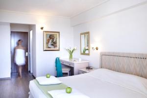 Postel nebo postele na pokoji v ubytování Amarilia Hotel