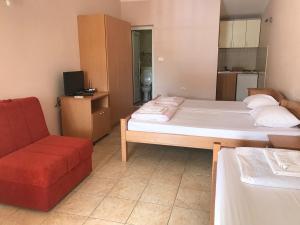 Postel nebo postele na pokoji v ubytování Apartmani Tomovic
