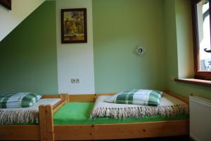 Posteľ alebo postele v izbe v ubytovaní Domek Na Wierchu i Apartament na Wierchu