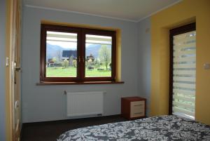 Posteľ alebo postele v izbe v ubytovaní Domek Na Wierchu i Apartament na Wierchu