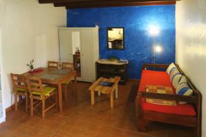 a living room with a couch and a table at Casa Rural SoleaRio in La Oliva