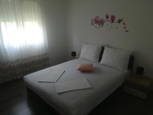 Postel nebo postele na pokoji v ubytování Apartmani Ivka