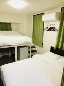 Postel nebo postele na pokoji v ubytování GreenHotel