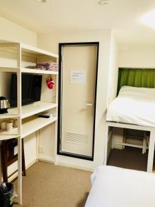 Postel nebo postele na pokoji v ubytování GreenHotel