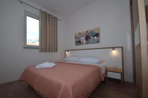 Postel nebo postele na pokoji v ubytování Apartment Anića Kuk