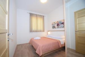 Postel nebo postele na pokoji v ubytování Apartment Anića Kuk