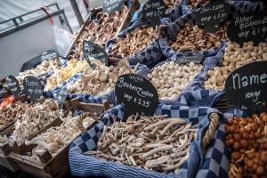 a display of different types of food on a market at City Break Amsterdam BNB in Amsterdam