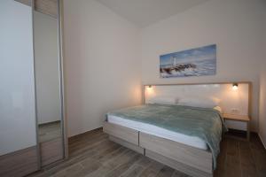 Postel nebo postele na pokoji v ubytování Apartment Anića Kuk