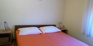 Posteľ alebo postele v izbe v ubytovaní Apartments Rukavina