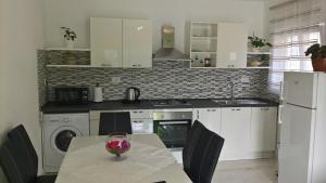 Kuchyň nebo kuchyňský kout v ubytování Apartman Zaklopatica