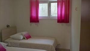 Postel nebo postele na pokoji v ubytování Apartman Zaklopatica