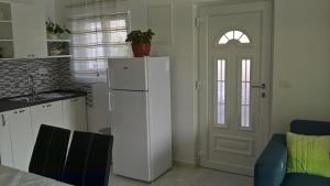 Kuchyň nebo kuchyňský kout v ubytování Apartman Zaklopatica