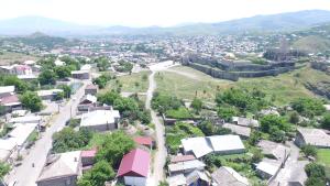 an aerial view of a small town with a mountain at Hotel Beni in Akhaltsikhe