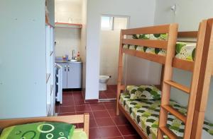 a small room with a bunk bed and a bathroom at Sea Cottage Studios in Budva