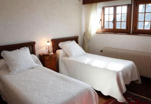 Postel nebo postele na pokoji v ubytování La Tourelle 22