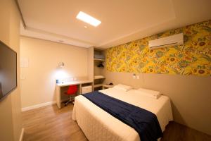 Ένα ή περισσότερα κρεβάτια σε δωμάτιο στο Hiber Hotel - Acesso a Chapecó