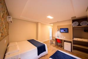 Ένα ή περισσότερα κρεβάτια σε δωμάτιο στο Hiber Hotel - Acesso a Chapecó