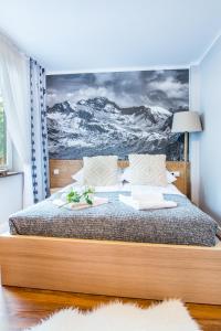 Posteľ alebo postele v izbe v ubytovaní Pałac Tatrzański Apartamenty