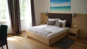 Postel nebo postele na pokoji v ubytování Villa Emilia + 15 fotografií