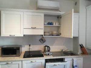 Kuchyň nebo kuchyňský kout v ubytování Casa Vacanze "ALCENTRO" + 13 fotografií