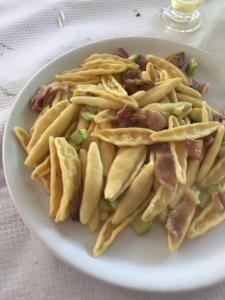 a plate of food with french fries on a table at Casa Vacanze Margherita - Sasso di Castalda in Sasso di Castalda +21 photos