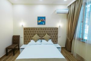 Ένα ή περισσότερα κρεβάτια σε δωμάτιο στο L'image Art Hotel