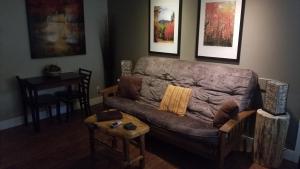 a living room with a couch and a table at Gondola Lodge in South Lake Tahoe