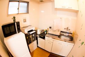 Kuchyň nebo kuchyňský kout v ubytování Moco hostel + 37 fotografií