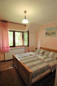 Posteľ alebo postele v izbe v ubytovaní Plitvice Rooms Family Glumac