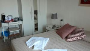 Postel nebo postele na pokoji v ubytování B&B Pierilu'