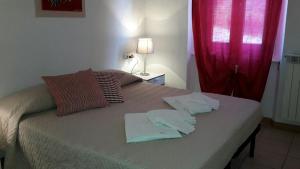 Postel nebo postele na pokoji v ubytování B&B Pierilu'