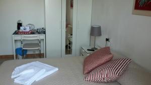 Postel nebo postele na pokoji v ubytování B&B Pierilu'