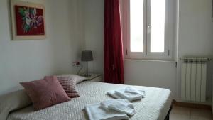Postel nebo postele na pokoji v ubytování B&B Pierilu'