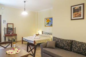 a living room with a couch and a table at Kerveli Luxury Villa in Kerveli