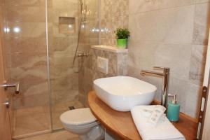 Kúpeľňa v ubytovaní Apartments Platana + 29 fotografií