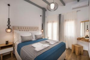 Кровать или кровати в номере Evlimeni Suites