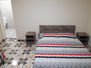 Postel nebo postele na pokoji v ubytování Joni Guest House