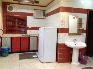 Kuchyň nebo kuchyňský kout v ubytování Safwt Aldyar Furnished Units