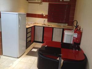 Kuchyň nebo kuchyňský kout v ubytování Safwt Aldyar Furnished Units
