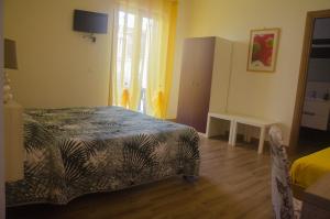 Postel nebo postele na pokoji v ubytování Baia Benessere B&B Eco Vegan