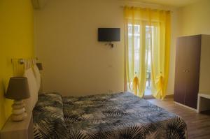 Postel nebo postele na pokoji v ubytování Baia Benessere B&B Eco Vegan