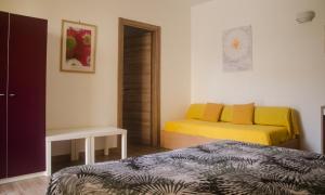 Postel nebo postele na pokoji v ubytování Baia Benessere B&B Eco Vegan