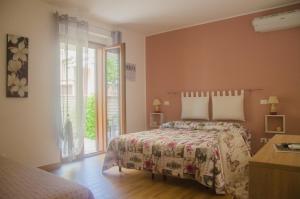 Postel nebo postele na pokoji v ubytování Baia Benessere B&B Eco Vegan