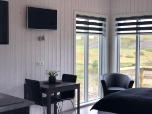 TV a/nebo společenská místnost v ubytování Afternoon Cottages