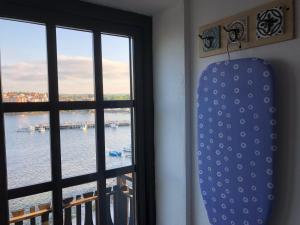 a window with a view of the water at The Greek House in Ahtopol