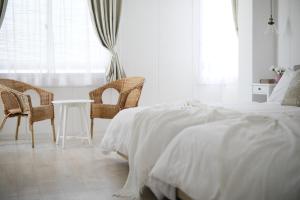 Ένα ή περισσότερα κρεβάτια σε δωμάτιο στο Bijou Suites Sorriso