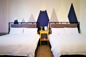 מיטה או מיטות בחדר ב-No.51 Ruisui Homestay